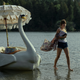Kinsey... walks on water alongside a swan boat, as you do.
